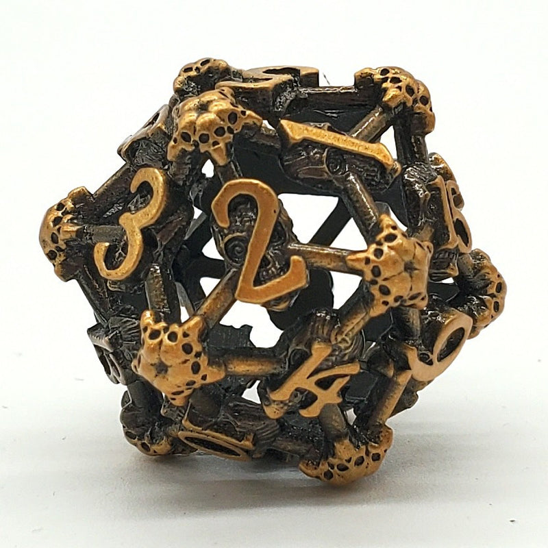 Old School Dice: Hollow Metal D20 Spindown - Skull Ancient Gold